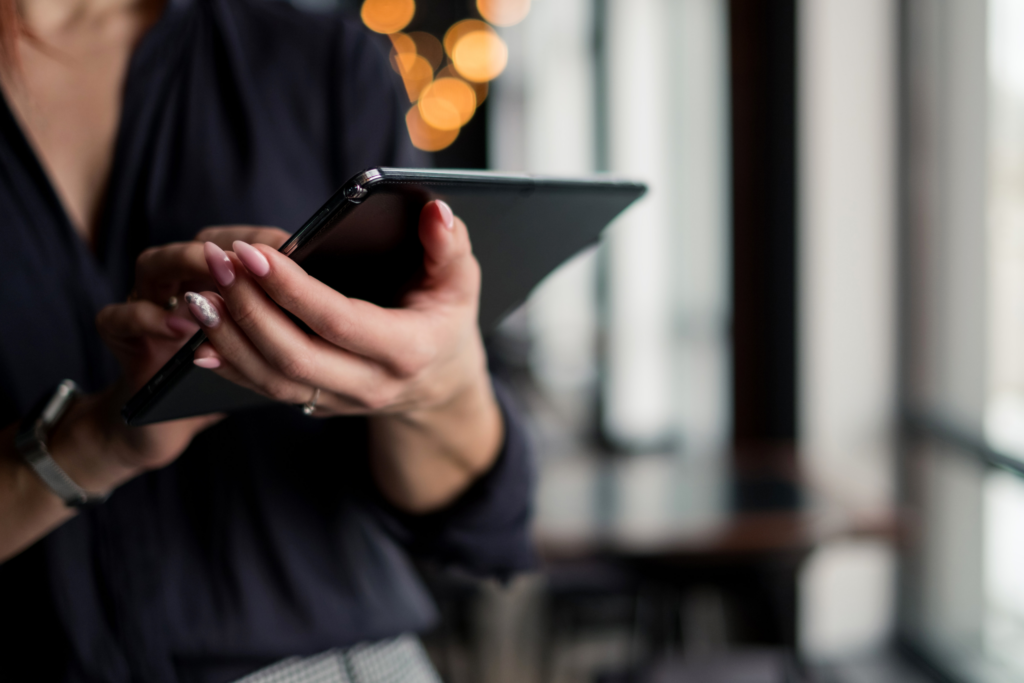 A woman using a tablet device