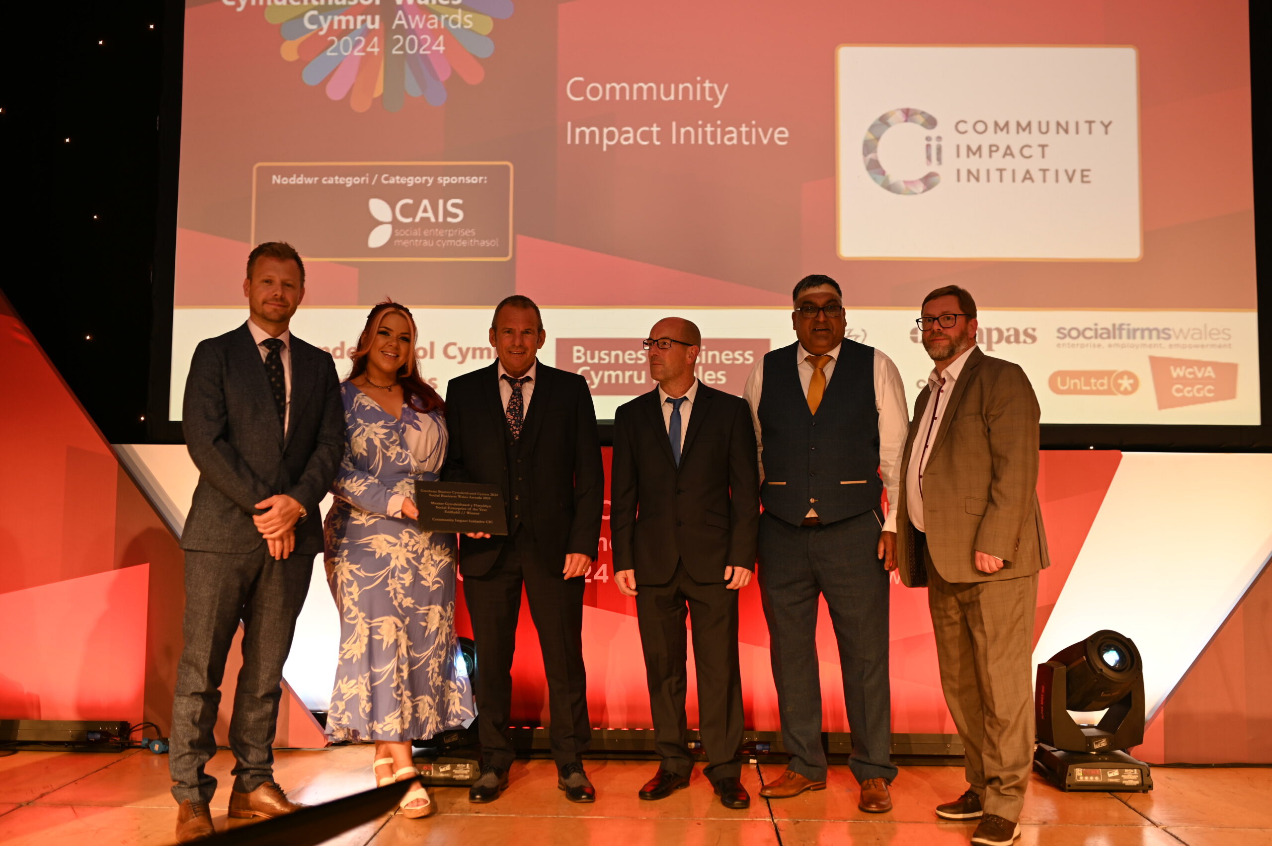 Community Impact Initiative collect their award at the Social Business Wales Awards 2024